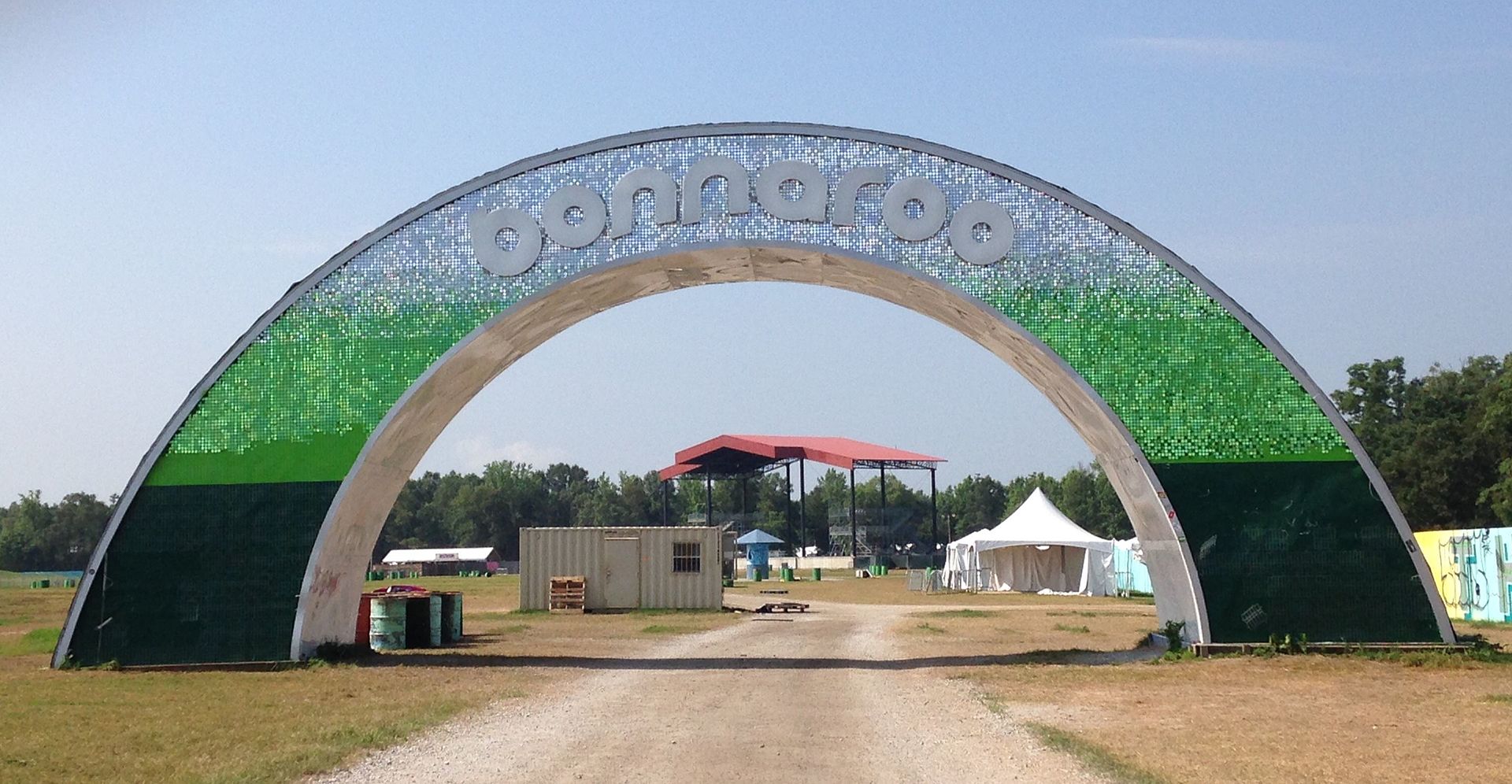 Outdoor concert crowd at Bonnaroo Music Festival in Tennessee under open skies