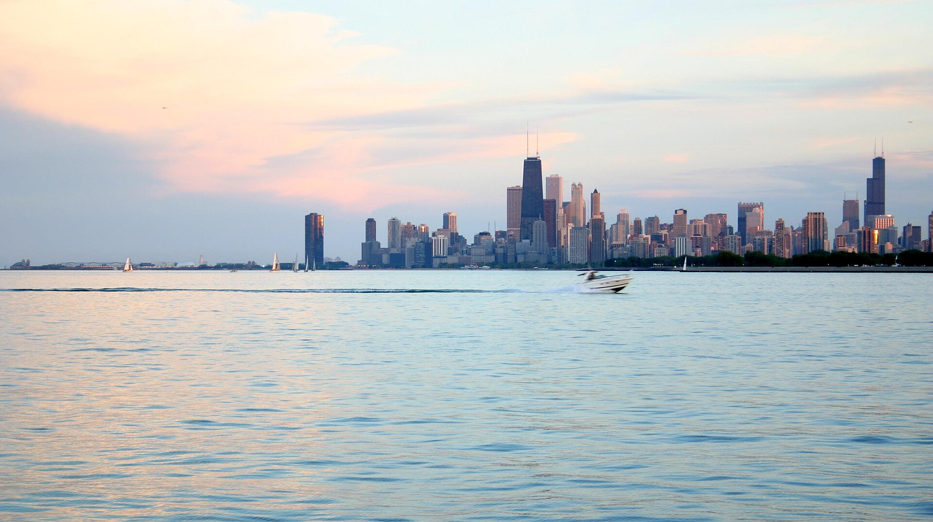 Lollapalooza main stage at Grant Park Chicago with city skyline at night