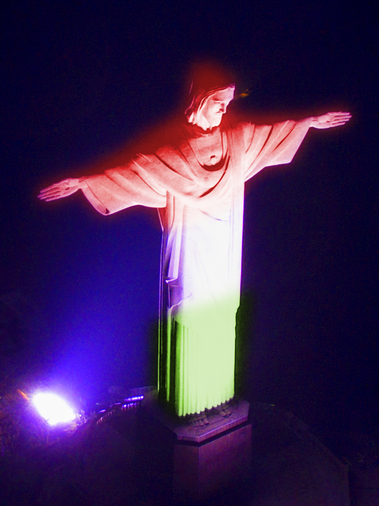 Rock in Rio Brazil festival main stage with crowd and Christ the Redeemer visible in background