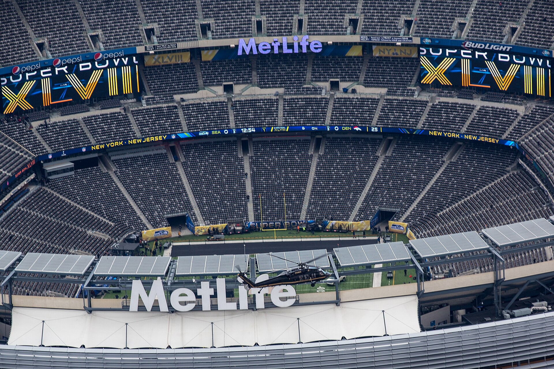 Super Bowl stadium filled with fans with confetti falling at NFL championship game